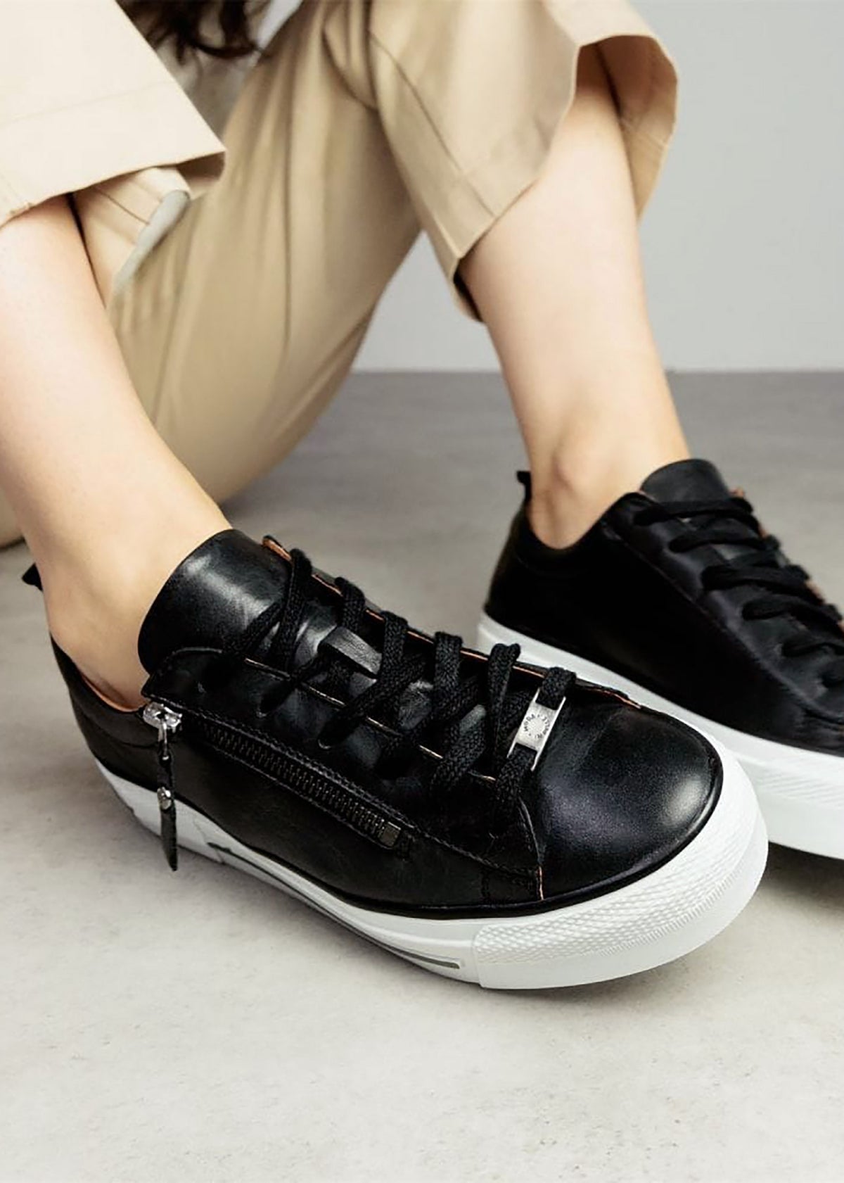 Filician Black Leather Side Zip Trainers