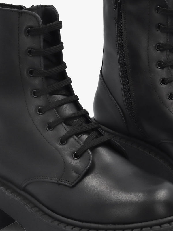 Black Leather Oversized Cleated Sole Ankle Boots