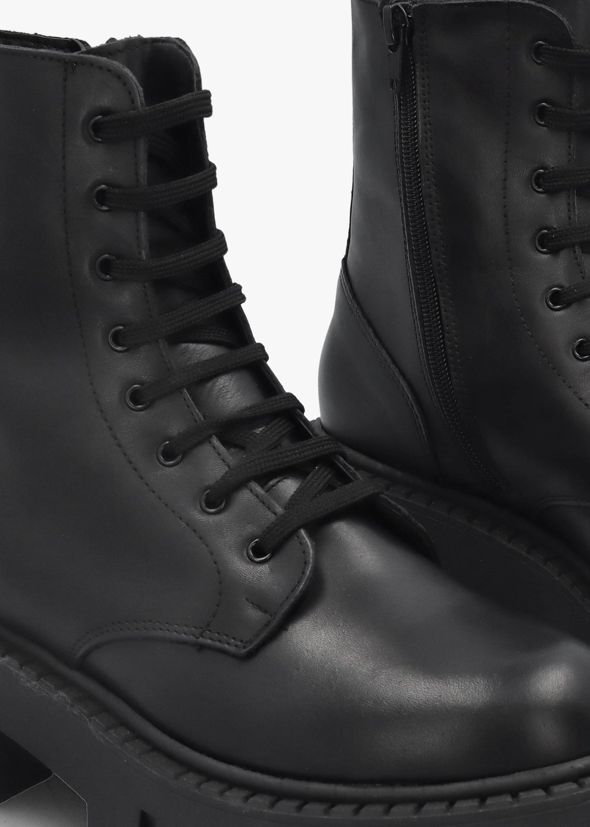 Black Leather Oversized Cleated Sole Ankle Boots