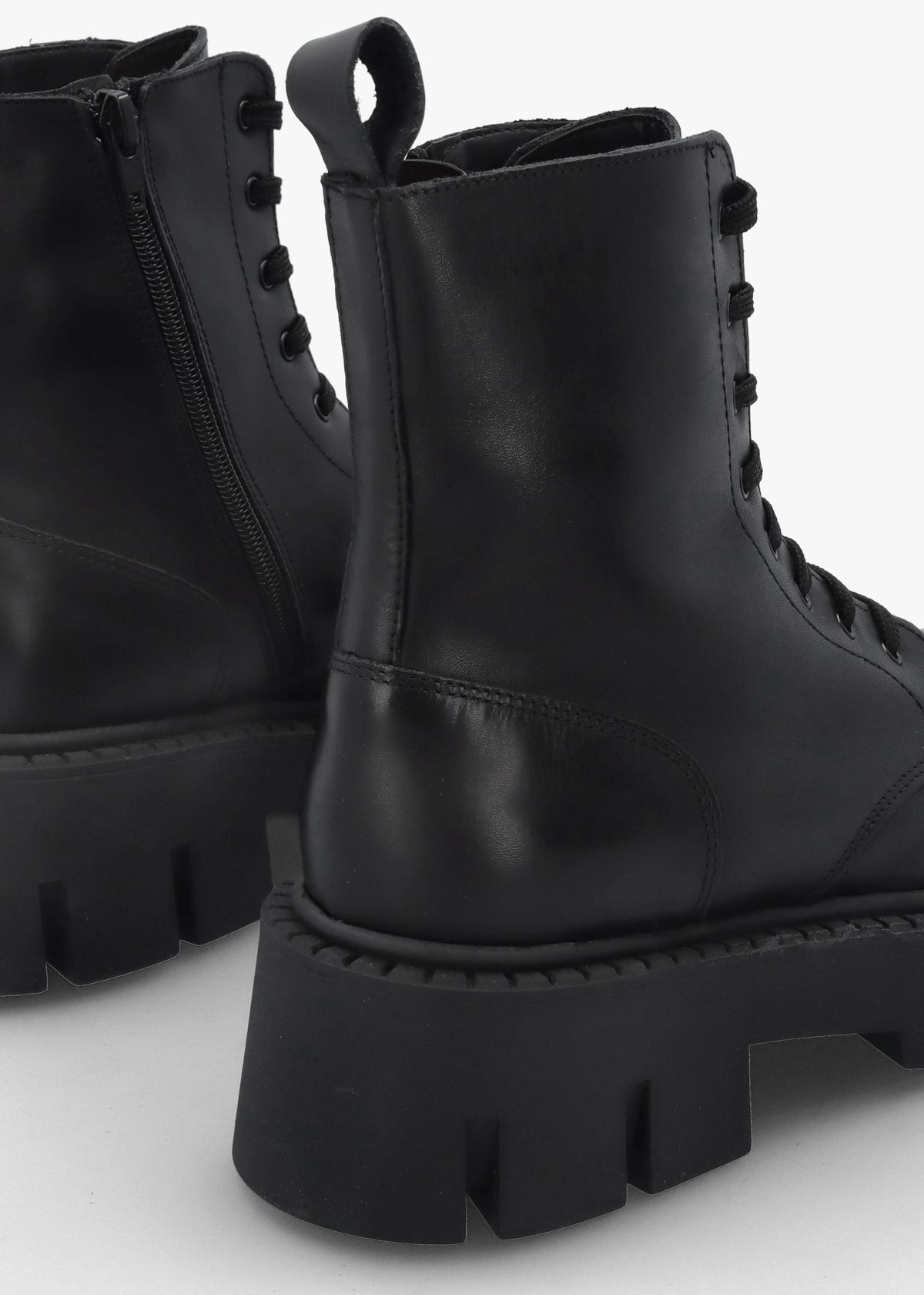 Black Leather Oversized Cleated Sole Ankle Boots